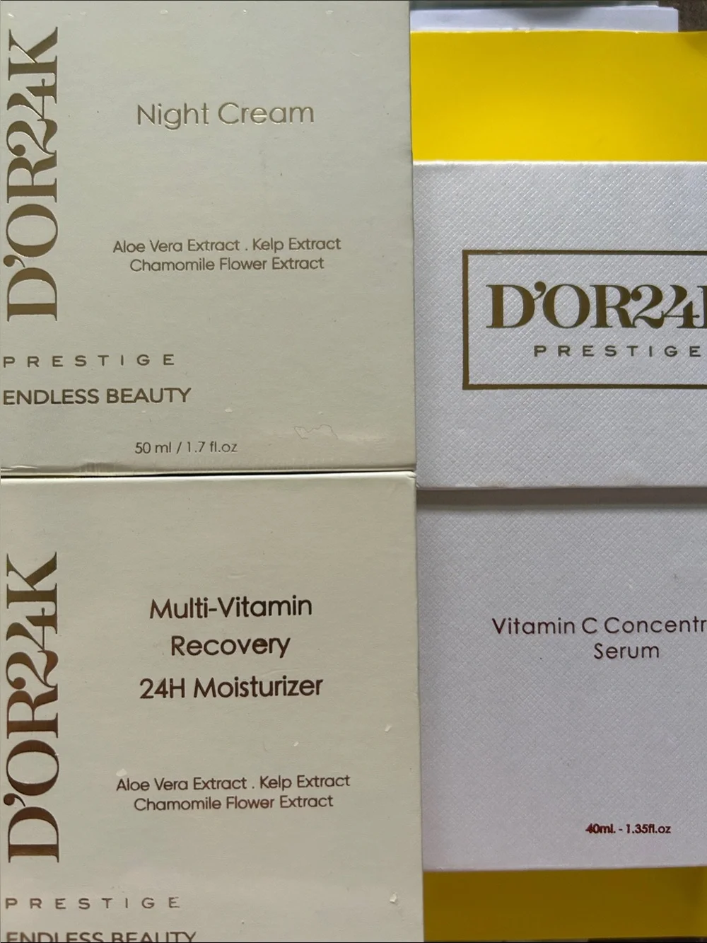 D'Or Skincare moisturizer set in cream, white and yellow packaging